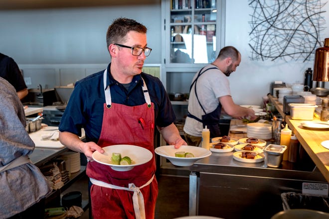 Executive chef and co-owner Doug Hewitt works in the open kitchen at Freya.