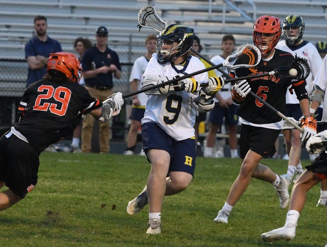 Under pressure from Brighton defenders, Hartland’s David Bullock puts a shoot on goal and scores in the fourth quarter.