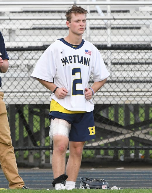 Hartland’s Bo Lockwood on the sidelines with his right thigh taped up in the second quarter after starting at the start of the game.