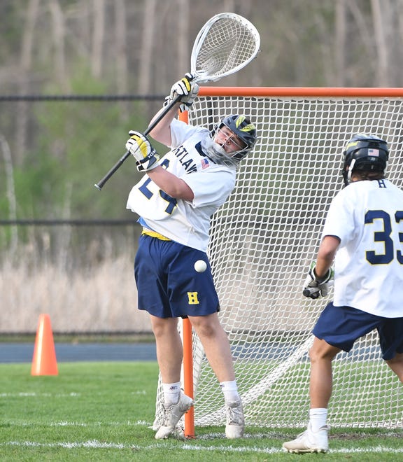 Hartland goalie Evan Phillips makes a save in the first quarter.