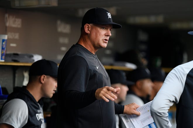 Detroit Tigers manager A.J. Hinch talks to a player before the team's game against the Baltimore Orioles, Friday, May 13, 2022, in Detroit.