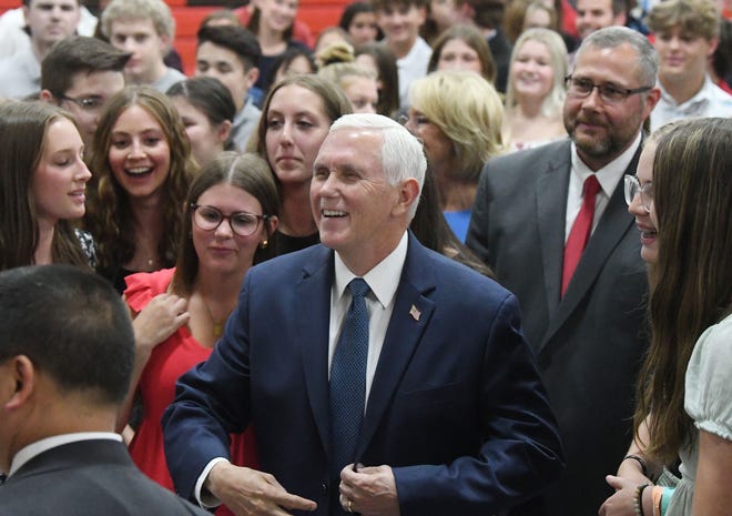 Former Vice President Mike Pence greets students at private school Lutheran High School Northwest after an assembly about a school of choice tax credit initiative.