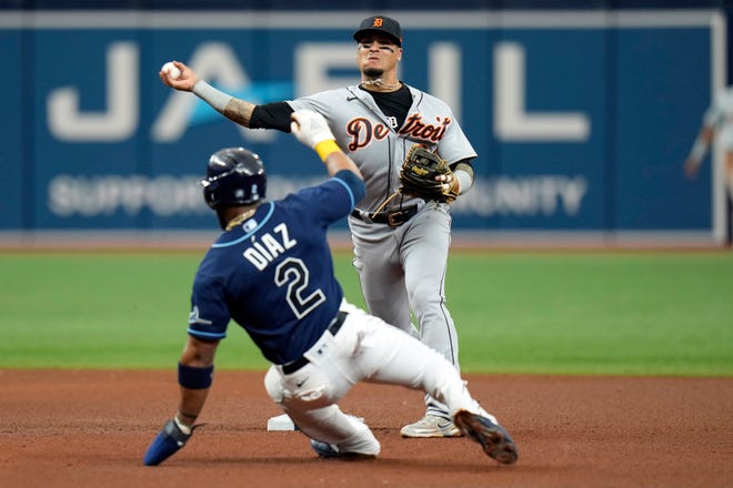 Detroit Tigers shortstop Javier Baez forces Tampa Bay Rays' Yandy Diaz (2) at seond base and relays the throw to first in time to turna double play on Wander Franco during the fourth inning.