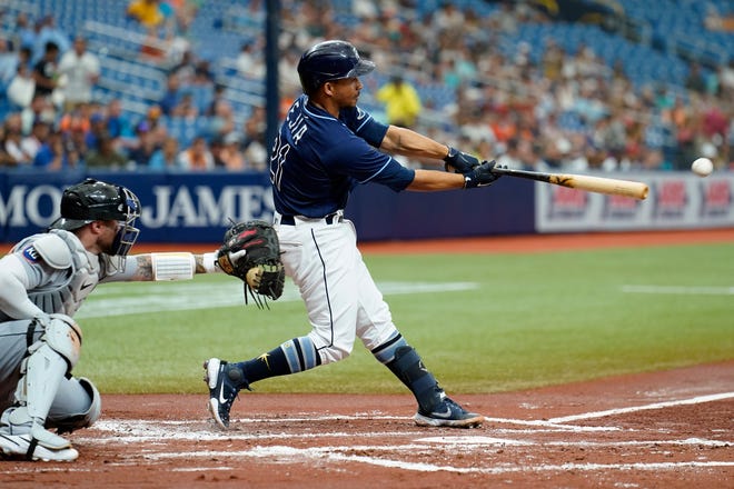 Tampa Bay Rays' Francisco Mejia (21) connects for a two-run single of Detroit Tigers starting pitcher Eduardo Rodriguez during the first inning.