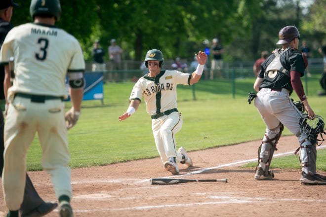 Wayne State infielder Jacob Finkbeiner slides safely into home during the seventh inning.