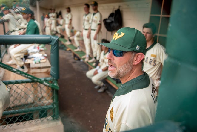 Wayne State head baseball coach Ryan Kelley yells out to his players during Thursday's game.