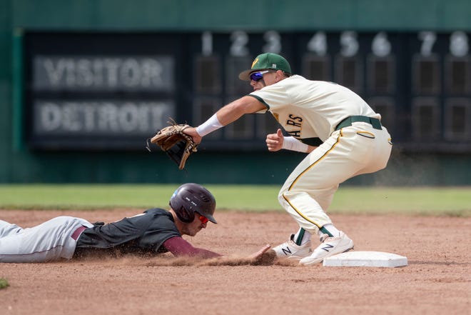 Wayne State's Jacob Finkbeiner tries to tag out Walsh's Jarret Lyon.