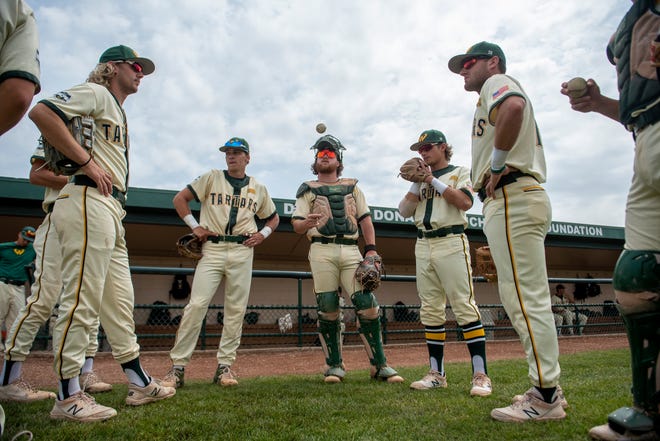 Wayne State baseball players hang out before the start of an NCAA Division II Midwest Regional game against Walsh on May 19, 2022 at Harwell Field on the campus of Wayne State University in Detroit.