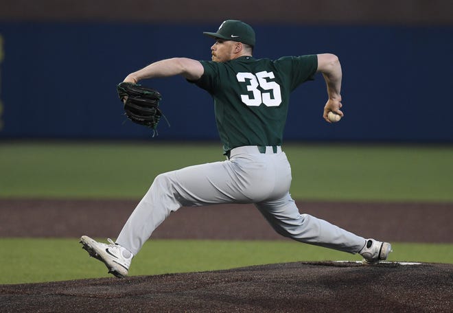 Michigan State relief pitcher Kyle Bischoff throws a pitch in the seventh inning.