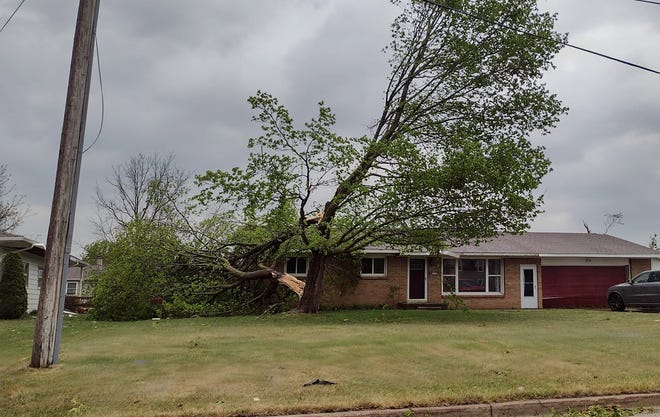 Amy Neuvirth photographed storm damage in a neighborhood in Gaylord after a tornado touched down on Friday afternoon.