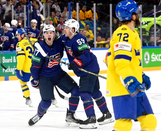 Team USA's Adam Gaudette, left, and Ben Meyers celebrate the opening goal against Sweden at the world hockey championship in Tampere, Finland.