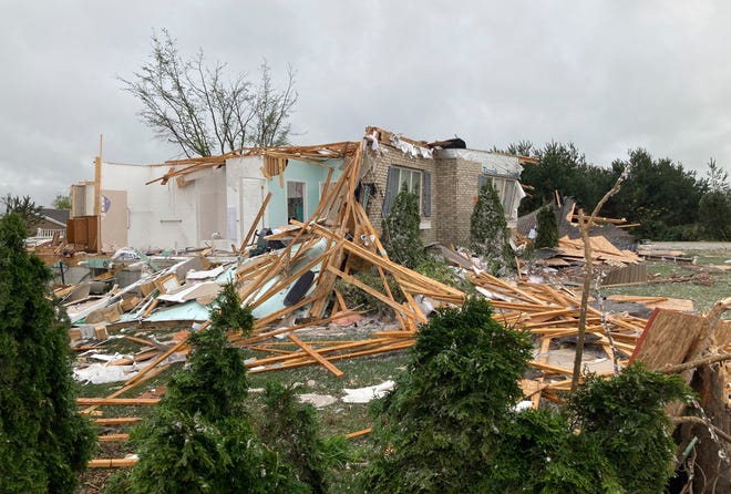 Damage is seen at a home after a tornado came through the area in Gaylord, Mich., Friday, May 20, 2022.