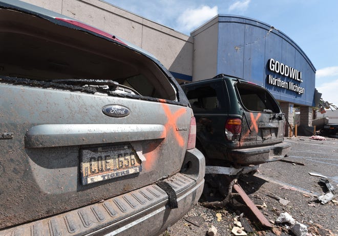 Vehicles are marked as checked for any persons at the Goodwill in Gaylord on May 21, 2022.