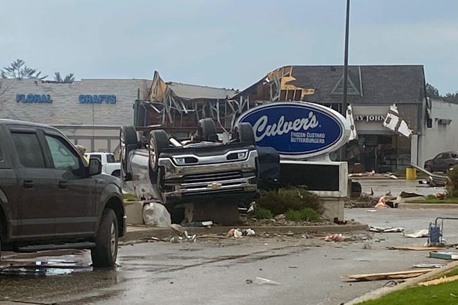This image provided by Steven Bischer, shows an upended vehicle following an apparent tornado, Friday, May 20, 2022, in Gaylord, Michigan.