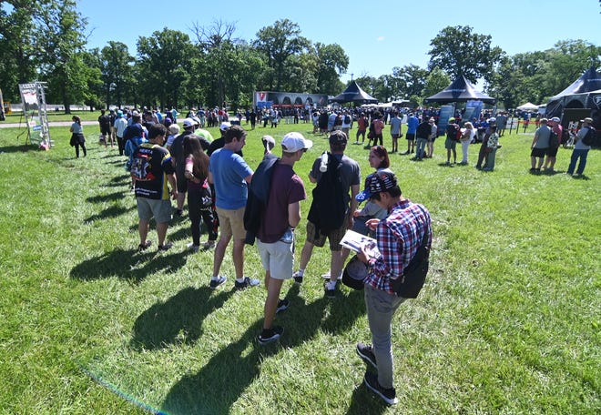 Race car fans line to get an autograph from an Indy Car drivers during the 2022 Chevrolet Detroit Grand Prix on Saturday, June 4, 2022.