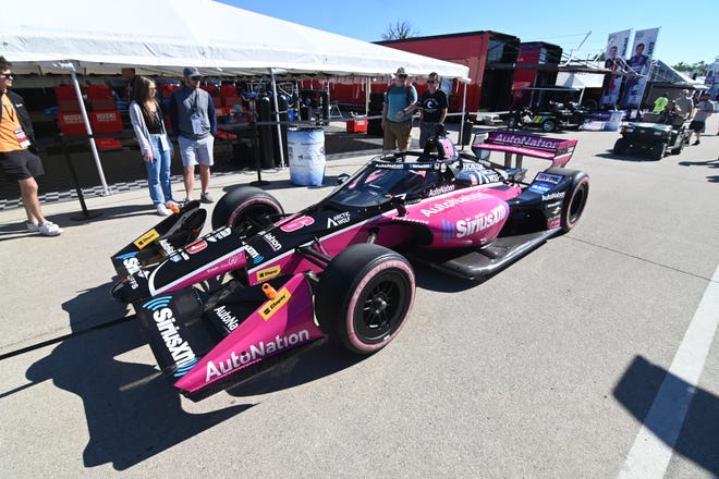 Indy car for Team Helio Castroneves (6) is towed into the paddock for the 2022 Chevrolet Detroit Grand Prix on Saturday, June 4, 2022.