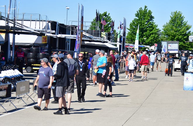 People walk through the paddock area for the 2022 Chevrolet Detroit Grand Prix on Saturday, June 4, 2022.
