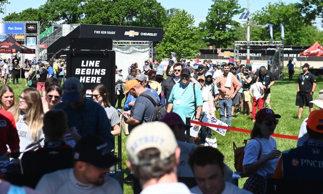 Race car fans line to get an autograph from Indy Car drivers during the 2022 Chevrolet Detroit Grand Prix on Saturday, June 4, 2022.