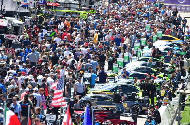Race fans pack pit lane for the open grid IMSA Weather Tech Sports Car Championship during the 2022 Chevrolet Detroit Grand Prix on Saturday, June 4, 2022.