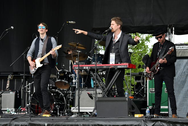 The Insiders perform on the stage near the Winner’s Circle at the Chevrolet Detroit Grand Prix on Belle Isle in Detroit on June 5, 2022.   
(Robin Buckson / The Detroit News)