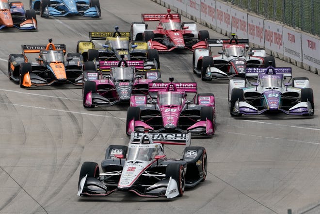 Josef Newgarden (2) leads the field into turn one during the IndyCar Detroit Grand Prix auto race on Belle Isle in Detroit, Sunday.