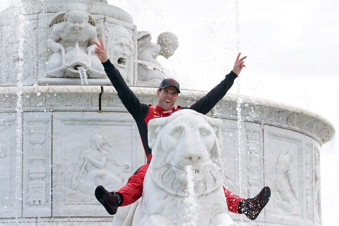 Will Power celebrates in the James Scott Memorial Fountain after winning the IndyCar Detroit Grand Prix auto race on Belle Isle in Detroit, Sunday, June 5, 2022. Sunday was the last race day on Belle Isle, next year, the race will be held in downtown Detroit.