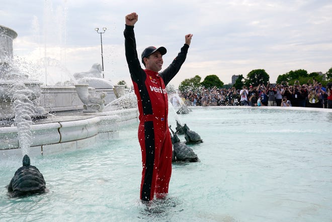 Will Power celebrates in Scott Fountain after winning the IndyCar Detroit Grand Prix auto race on Belle Isle in Detroit, Sunday, June 5, 2022.