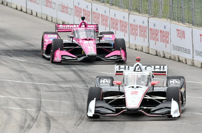IndyCars racers Josef Newgarden (front) and Simon Pagenaud navigate a curve during the Detroit Grand Prix on Belle Isle, Sunday.