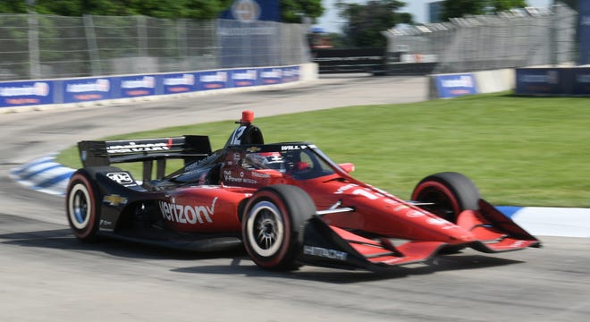 Will Power in the #12 car in the lead seen here in turn 8 at the Detroit Grand Prix.
