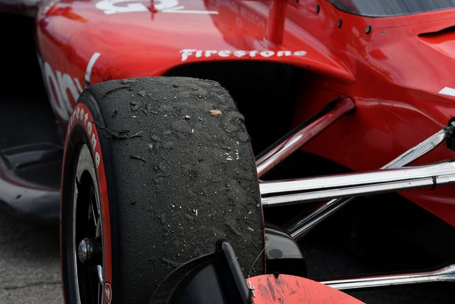Debris stuck to one of the tires on Will Power's car after the Detroit Grand Prix.