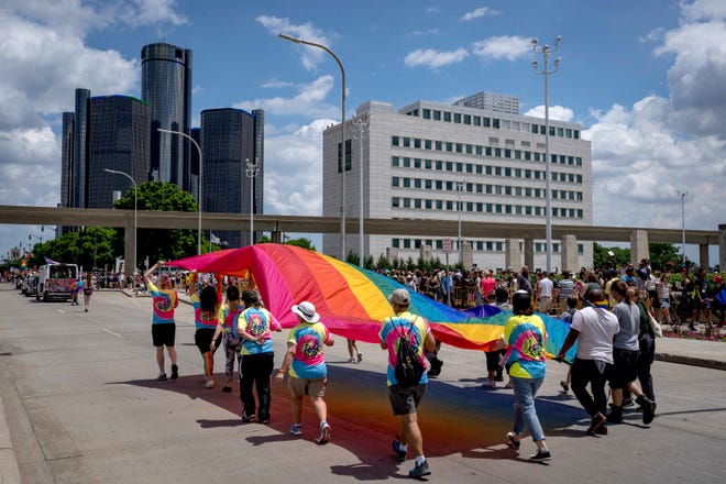 People march in the Motor City Pride parade in Detroit.