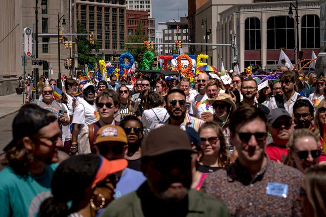 People gather during the Motor City Pride parade in Detroit.
