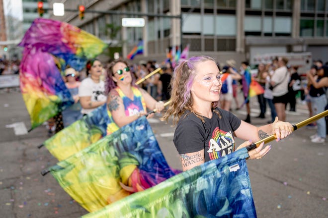 Laya Suvada of Belleville spins a flag during the Motor City Pride parade in Detroit.