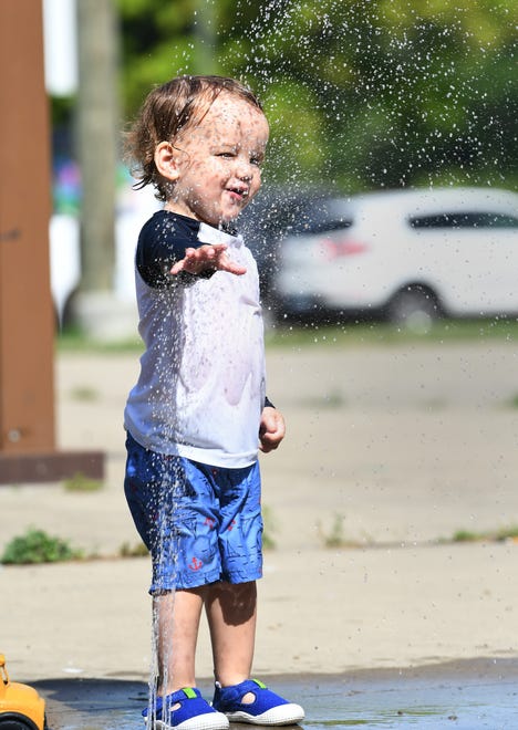 Hudson Elifritz, 2, of Detroit, enjoys the Palmer Park Splash Pad in Detroit.