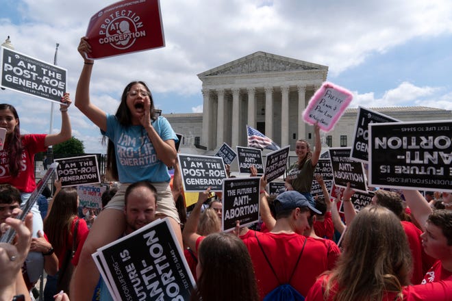 Anti-abortion protesters celebrate outside the Supreme Court in Washington, Friday, June 24, 2022. The Supreme Court has ended constitutional protections for abortion that had been in place nearly 50 years, a decision by its conservative majority to overturn the court's landmark abortion cases.