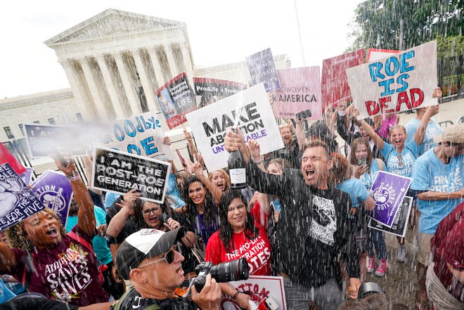 A celebration outside the Supreme Court, Friday, June 24, 2022, in Washington. The Supreme Court has ended constitutional protections for abortion that had been in place nearly 50 years – a decision by its conservative majority to overturn the court's landmark abortion cases.