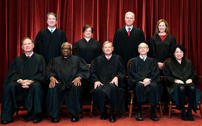 Members of the Supreme Court pose for a group photo at the Supreme Court in Washington, April 23, 2021. Seated from left are Associate Justice Samuel Alito, Associate Justice Clarence Thomas, Chief Justice John Roberts, Associate Justice Stephen Breyer and Associate Justice Sonia Sotomayor, Standing from left are Associate Justice Brett Kavanaugh, Associate Justice Elena Kagan, Associate Justice Neil Gorsuch and Associate Justice Amy Coney Barrett.