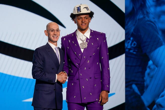 Paolo Banchero, right, poses for a photo with NBA Commissioner Adam Silver after being selected as the number one pick overall by the Orlando Magic in the NBA basketball draft, Thursday, June 23, 2022, in New York.