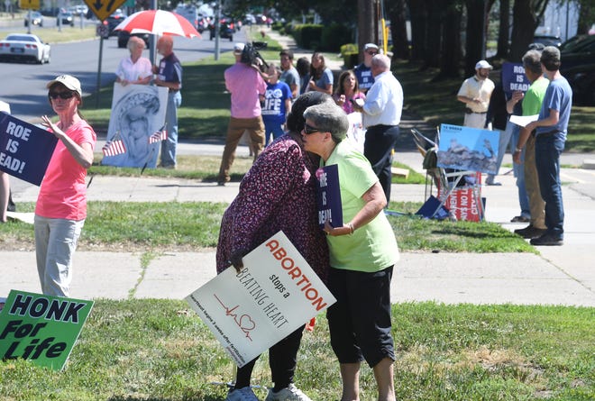 Miriam Respires and Sandy Rogala hug during a pro-life gathering outside a Planned Parenthood center in Livonia, Michigan on June 24, 2022.