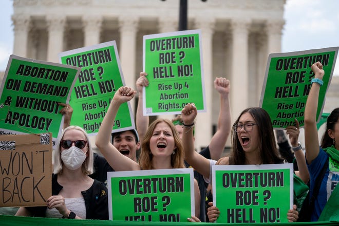 Abortion-rights protesters regroup and protest following Supreme Court's decision to overturn Roe v. Wade  in Washington, Friday, June 24, 2022. The Supreme Court has ended constitutional protections for abortion that had been in place nearly 50 years, a decision by its conservative majority to overturn the court's landmark abortion cases.