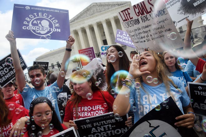 Anti-abortion campaigners celebrate outside the US Supreme Court in Washington, DC, on June 24, 2022.