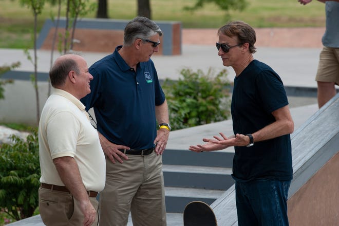Legendary skateboarder Tony Hawk (right) chats with Detroit Mayor Mike Duggan and David Egner, president and CEO of the Ralph C. Wilson Jr. Foundation, during the grand opening of the new Chandler Park Skatepark in Detroit.