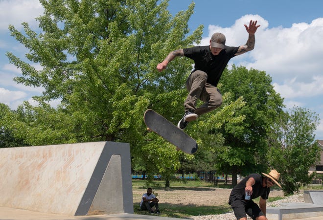 Skater Dustin Blauvelt, 32, of Westland catches some air during the grand opening of the new Chandler Park Skatepark in Detroit.