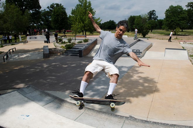 Skater Sean Agopian, 48, of Taylor does a trick during the grand opening of the new Chandler Park Skatepark in Detroit on Sunday, June 26, 2022.