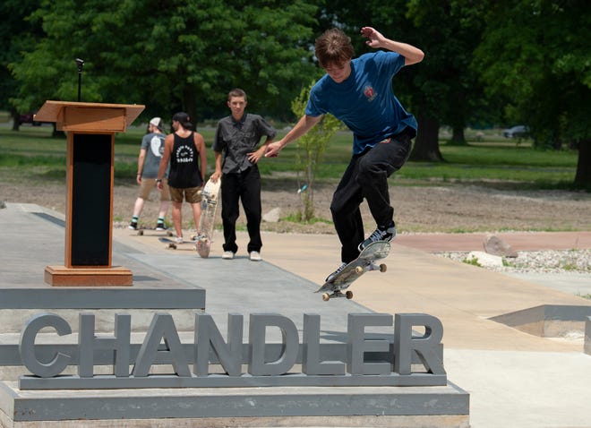 Skater Jason Couch, 19, of Livonia flies over the 'Chandler' sign during the grand opening of the new Chandler Park Skatepark in Detroit.