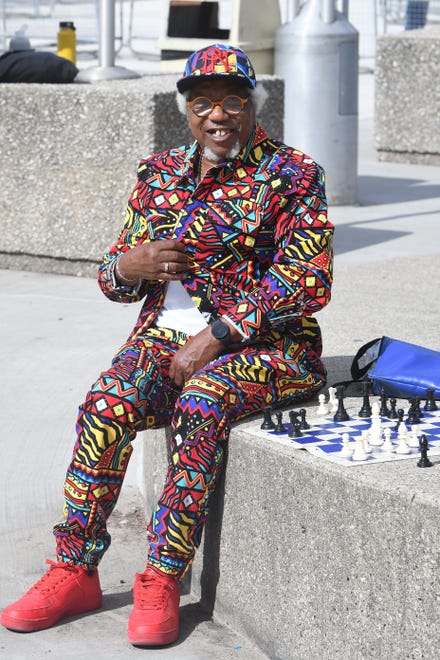 Bobbie Senior makes a strong fashion statement while playing chess in Hart Plaza before the fireworks display.