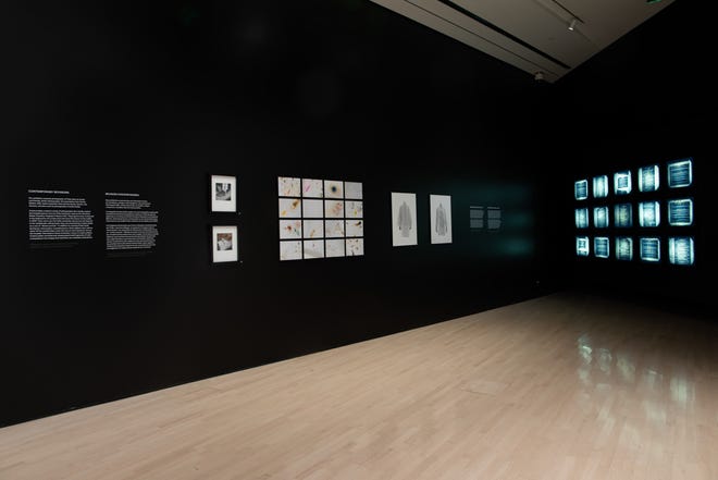 Light boxes illuminate Kahlo's medical records in "Kahlo Without Borders" at the MSU Broad Art Museum.