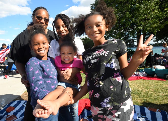 Gisele Halliburton with her grandchildren Leia Yawson Dickerson, 9, Janiyah Jarrett, 10, Amora Dickerson, 3, and Azaryah Jarrett before the fireworks display, "I'm so happy the fireworks are back. I think I'm more happy and excited than the kids are."