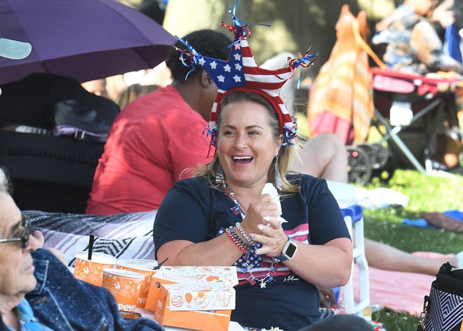 Heather Aldrich of Ferndale has some fun and food while waiting for the 2022 Ford Fireworks in Detroit, Michigan, on June 27, 2022.
