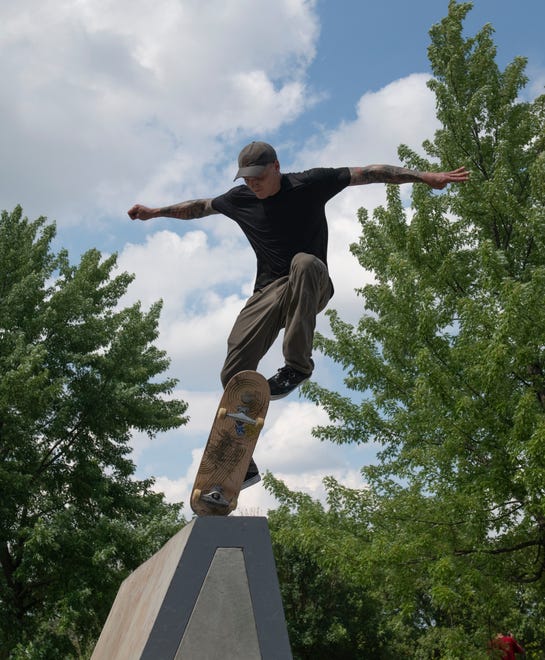 Skater Dustin Blauvelt, 32, of Westland catches some air during the grand opening of the new Chandler Park Skatepark in Detroit.